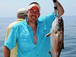 Jigging-for-Amberjacks-while-deep-sea-fishing-in-Orange-Beach-with-Distraction-Charters