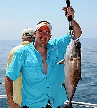 Jigging-for-Amberjacks-while-deep-sea-fishing-in-Orange-Beach-with-Distraction-Charters