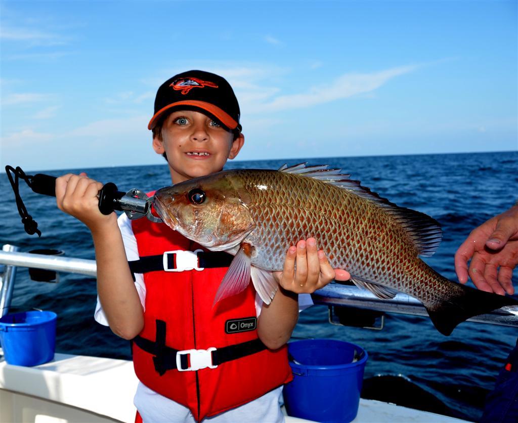 kids learning how to fish in orange beach