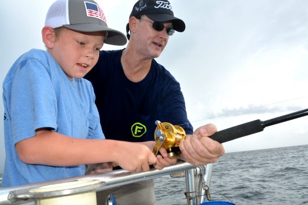 kids fishing with dad