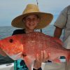 child-holding-red-snapper-fish