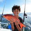 boy holding vermilion snapper