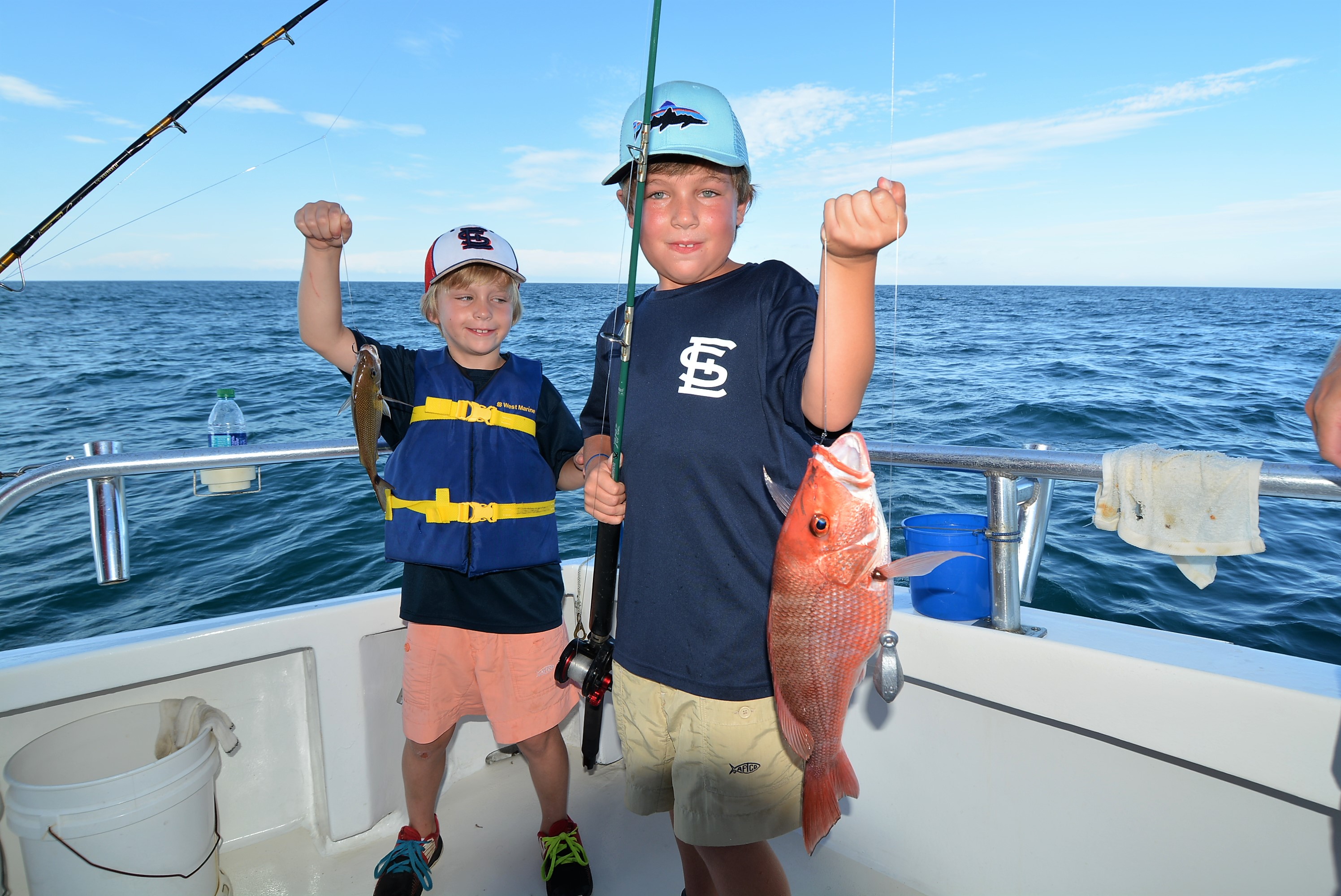 boys-fishing-first-red-snapper - Distraction Charters