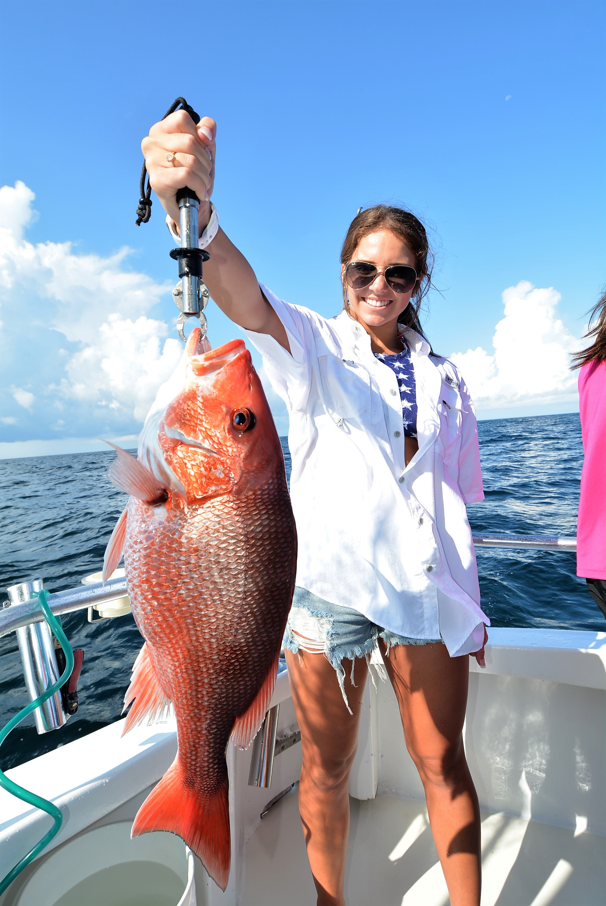 girl-holding-red-snapper-gulf-shores - Distraction Charters